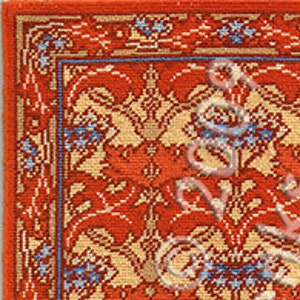 May include: A needlepoint rug kit featuring a floral design in shades of orange, yellow, and blue. The kit includes instructions and materials for creating a rug measuring 7 inches by 10 inches.