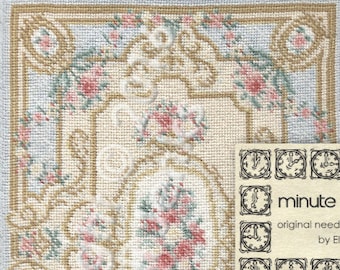 May include: A needlepoint rug pattern for a miniature rug called "Heath Lodge". The pattern is 5 inches by 8 inches and is worked on 22 count canvas. The rug features a floral design with pink and green flowers on a cream background.