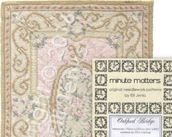 May include: A needlepoint pattern for a rug called "Oakford Bridge" by Minute Matters. The pattern measures 6 5/8 inches by 8 5/8 inches and is worked on 22 count canvas.