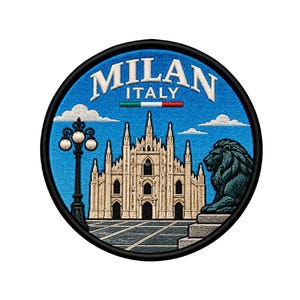 May include: A circular embroidered patch featuring the Milan Cathedral in beige against a blue sky. The text MILAN ITALY appears at the top with a small Italian flag graphic. A black street lamp stands on the left and a lion statue on the right.