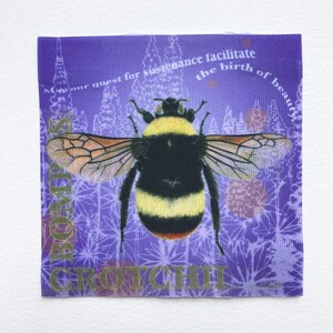 May include: A purple fabric patch with a bee illustration and the text "May your quest for sustenance facilitate the birth of beauty" and "GROTCHIL" in gold lettering.