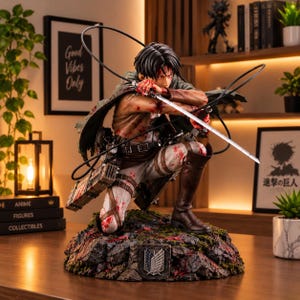 May include: A detailed anime character figurine in a kneeling combat pose, featuring a dark green cape, brown boots, and white pants splattered with red paint. The figure holds a silver sword and is mounted on a rocky base with a shield emblem.