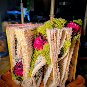 Crystallized "Beauty and the Beast" book with resined flowers and moss.
