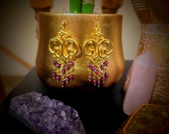 Gold tone genuine ruby crystal chandelier earrings approximately 2.75"