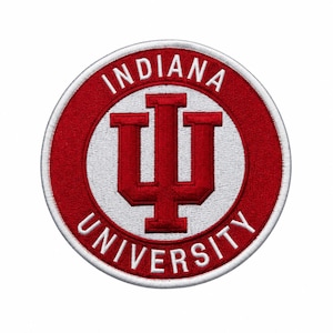 May include: A circular embroidered patch featuring a red and white colour scheme. The centre displays a large red interlocking IU logo on a white background. The words INDIANA UNIVERSITY are stitched in white capital letters along the red border.
