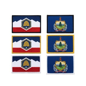 May include: Six rectangular embroidered patches arranged in two columns. The left column features three patches with a blue, white, and red design containing a yellow beehive emblem. The right column shows three Vermont state flag patches.