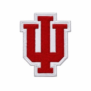May include: A red and white embroidered patch featuring the Indiana University IU logo. The design consists of a bold red letter I overlapping a larger red letter U, both outlined with a thick white border and a secondary red border.