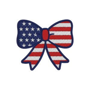 May include: An embroidered patch shaped like a bow, featuring a dark blue left side with white stars and a red and white striped right side and tails. The center knot is solid red, and the entire bow is outlined with a thick dark blue border.