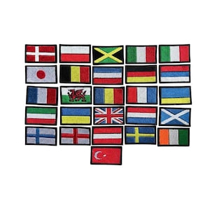 May include: A collection of rectangular embroidered patches featuring various national flags, including designs with stripes, crosses, and symbols like the Welsh dragon and the Turkish crescent and star, all bordered with a black stitched edge.