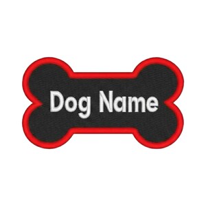 May include: A bone-shaped embroidered patch featuring a black center with the white text Dog Name centered in the middle. The patch is outlined with a thick, vibrant red border that follows the curved contours of the bone shape throughout.