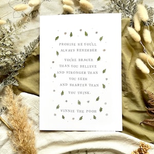 May include: A white printable quote with green leaves and stars. The quote reads "Promise me you'll always remember you're braver than you believe and stronger than you seem and smarter than you think."  The quote is attributed to Winnie the Pooh.