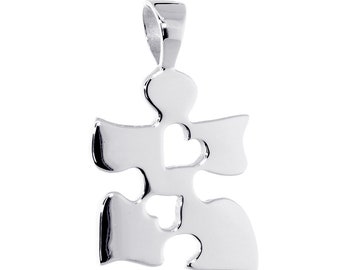 May include: Silver-toned puzzle piece pendant with two heart cutouts. The pendant is designed to be worn as a necklace.