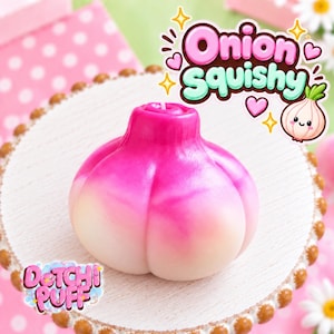 May include: A squishy toy shaped like an onion with a gradient of pink and white colors. The toy features a rounded, bulbous form with vertical indentations. Text in the image reads Onion Squishy and Dotchi Puff, accompanied by a small onion icon.