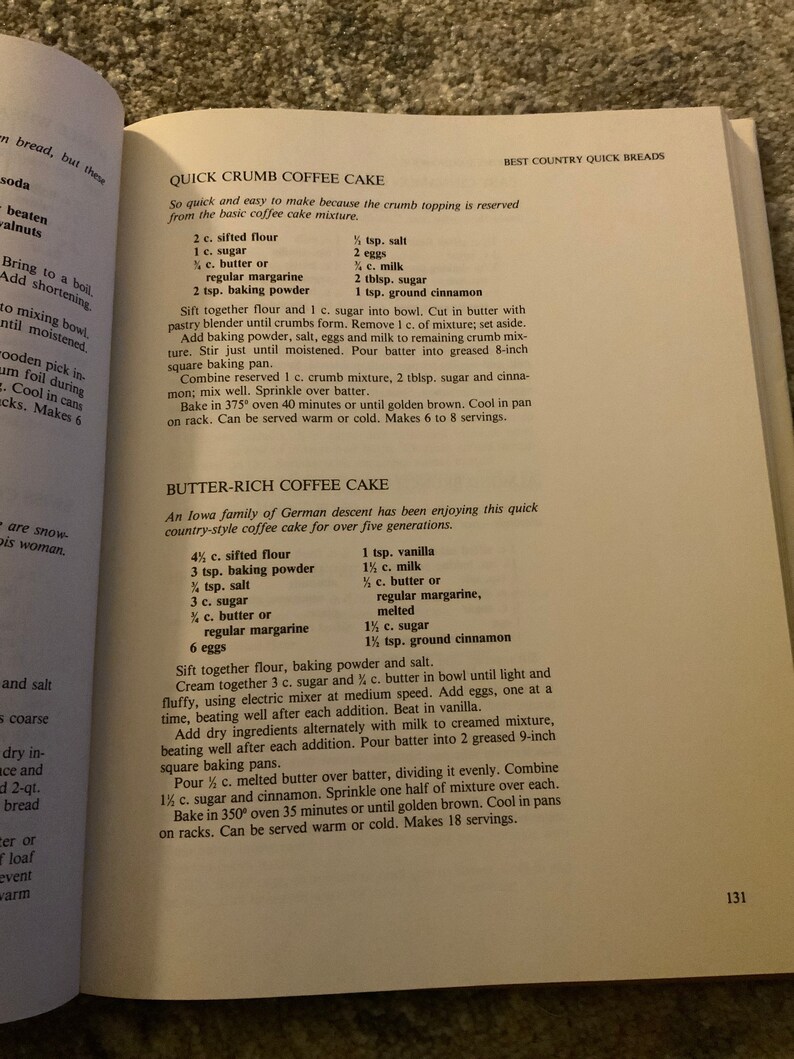 May include: A vintage cookbook page with two recipes for coffee cake: Quick Crumb Coffee Cake and Butter-Rich Coffee Cake. The recipes list ingredients and instructions for baking the cakes.