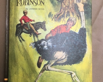 May include: A vintage book cover with a green, yellow, and brown background. The title is "The Swiss Family Robinson" by Johann Wyss. The cover features a boy riding a donkey and a large ostrich running in the foreground.