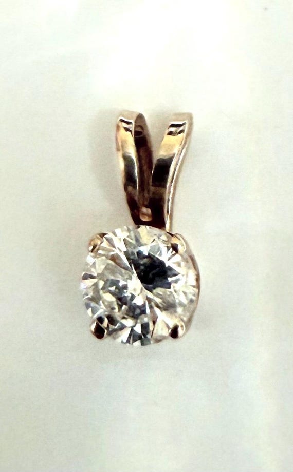 Gorgeous 14k Diamond  Solitaire Pendant.  Weighing .4 grams