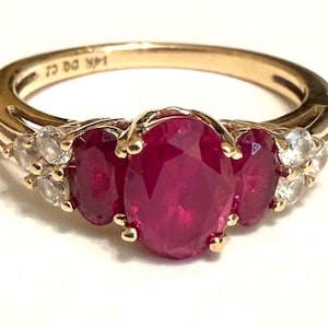 Beautiful 14k Triple Oval Rubies  and CZ Ring Weighing 2.7 grams. Size is a bit under a 6