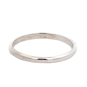 May include: A simple, plain silver wedding band.