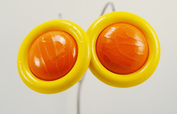 orange colored earrings 1980