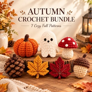 May include: A collection of seven crocheted items including an orange pumpkin, a white ghost, a red and white mushroom, a brown pinecone, a yellow maple leaf, a red maple leaf, and an acorn, with text reading AUTUMN CROCHET BUNDLE 7 Cozy Fall Patterns.