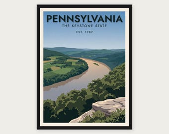 Puede incluir: Un póster de viaje enmarcado que muestra un paisaje de Pensilvania con un río sinuoso, colinas verdes y acantilados rocosos. El texto dice PENNSYLVANIA THE KEYSTONE STATE EST. 1787 en letras azul oscuro sobre un cielo azul claro.