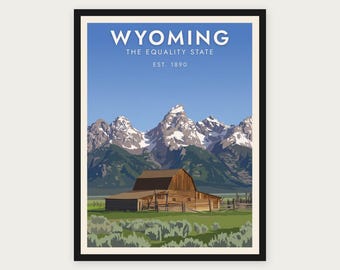 Puede incluir: Un póster de viaje enmarcado que muestra un granero de madera marrón en un campo verde con artemisa, frente a montañas nevadas bajo un cielo azul. El texto dice WYOMING THE EQUALITY STATE EST. 1890 en letras blancas mayúsculas.