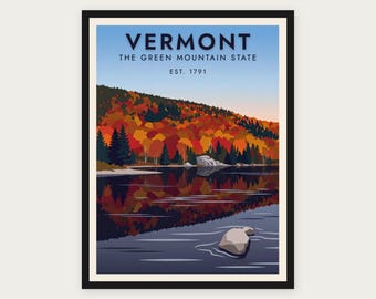Puede incluir: Una lámina artística enmarcada con un paisaje de Vermont, follaje otoñal en tonos rojos, naranjas y amarillos reflejados en un lago tranquilo. El texto dice VERMONT THE GREEN MOUNTAIN STATE EST. 1791 sobre un cielo azul claro.