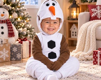 May include: A white and brown plush costume featuring an attached hood with a carrot nose, twig-like hair, and two black hexagonal buttons on the chest. The long-sleeved jumpsuit is made of soft fabric and includes integrated mittens for the hands.
