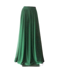 May include: A long, flowing green skirt with a simple elastic waistband.
