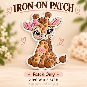 May include: An embroidered iron-on patch featuring a cartoon giraffe with brown spots, a pink bow on its head, and a pink heart on its chest. The text reads IRON-ON PATCH, Patch Only, and 2.99 W x 3.54 H. The design includes small heart outlines.