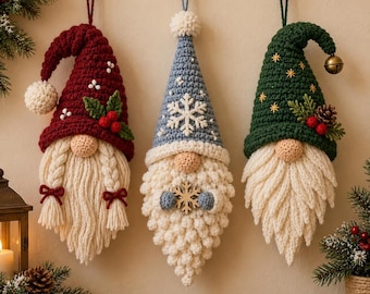 May include: Three hanging crochet gnome ornaments. The left gnome has a red hat with white pom-poms, holly, and braided beard. The center gnome has a blue hat with a white snowflake and a wooden snowflake. The right gnome has a green hat with gold stars, holly, and a bell.