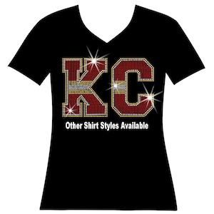 a t - shirt with the kcc logo on it