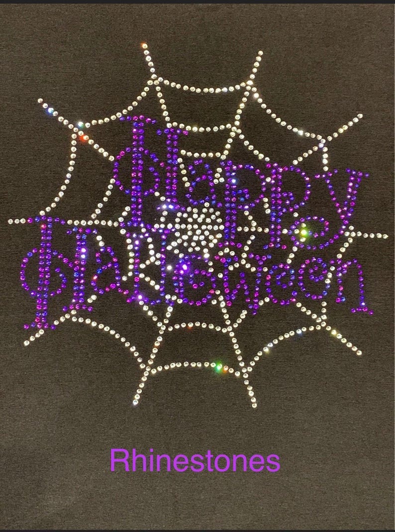 This is an actual picture of our Happy Halloween rhinestone shirt with sparkling spider web inspired design, spooky Halloween apparel for parties, trick or treating and October celebrations in rhinestones.