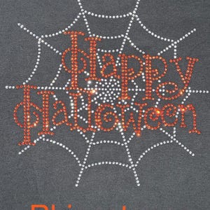 This is an actual picture of our Happy Halloween rhinestone shirt with sparkling spider web inspired design, spooky Halloween apparel for parties, trick or treating and October celebrations in rhinestones.