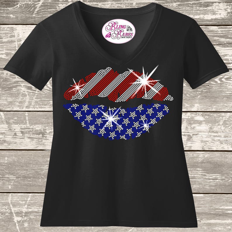 Sparkling rhinestone American flag lips shirt on a black t-shirt, patriotic bling tee for women with red white and blue lips design.