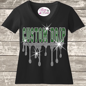 A black t-shirt with a white rhinestone design that spells out "GUSTOM DRIP" with a dripping effect.