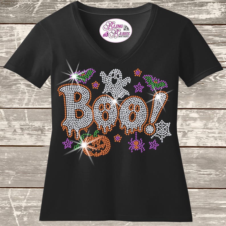 Boo Ghost Halloween rhinestone shirt featuring a cute sparkling ghost design for spooky season, Halloween parties, trick or treating and October events.