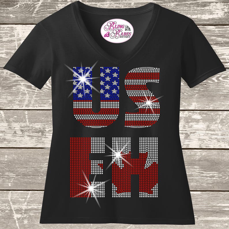 US EH Canadian USA rhinestone shirt with sparkling crystal lettering on a unisex tee, patriotic bling apparel for women, funny USA and Canada themed shirt with high shine rhinestones