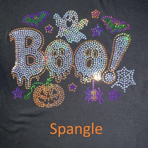 This is an actual picture of our Boo Halloween design featuring fun, spooky-inspired lettering embellished with sparkling spangle for a playful and glamorous look. Perfect for Halloween parties, trick-or-treating, pumpkin patch outings, spooky season celebrations, and anyone who loves cute Halloween fashion with a little sparkle, sass, and bling.