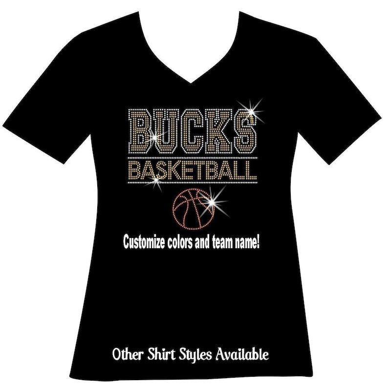 Custom basketball bedazzled bling shirt. Your team name. Your choice of 2colors. The name outlined. A line, then basketball. A line then an orange basketball. You can customize your team name and team colors. Varsity font and thousands of rhinestones