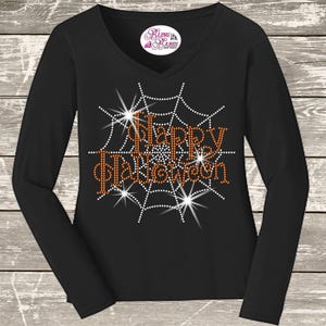 Happy Halloween rhinestone shirt with sparkling spider web inspired design, spooky Halloween apparel for parties, trick or treating and October celebrations.