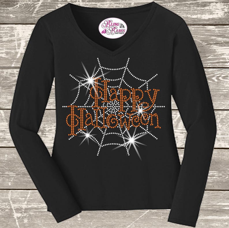 Happy Halloween rhinestone shirt with sparkling spider web inspired design, spooky Halloween apparel for parties, trick or treating and October celebrations.