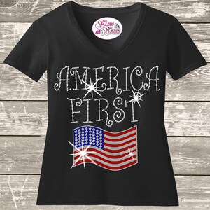 America first rhinestone shirt with American flag design on a unisex tee, patriotic bling apparel for women, bold USA statement shirt with high shine rhinestones