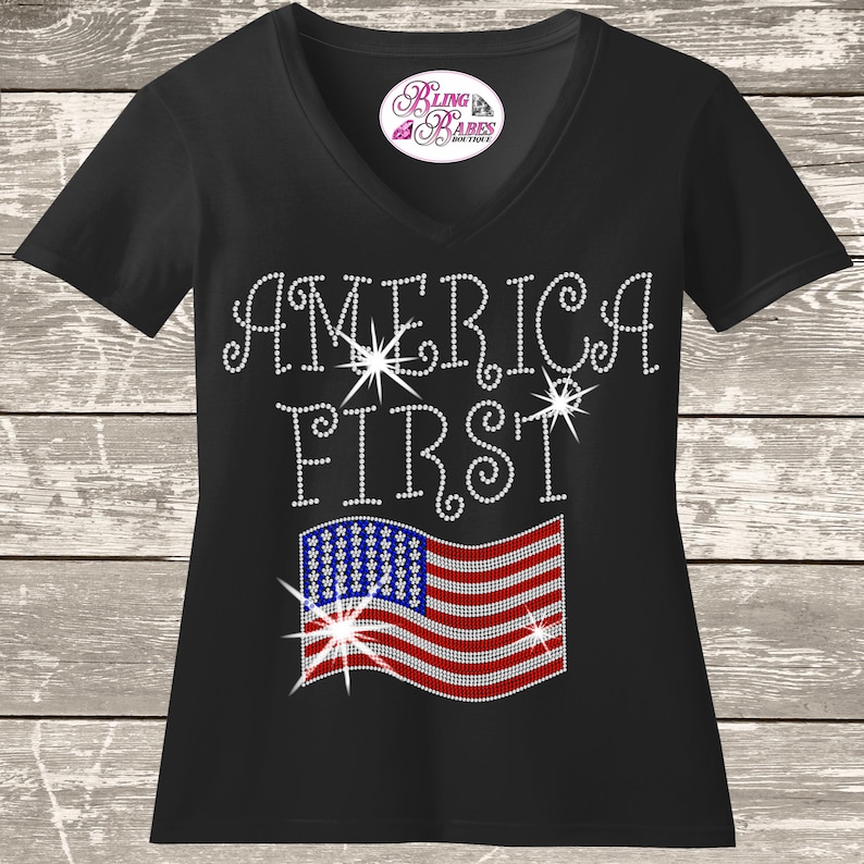 America first rhinestone shirt with American flag design on a unisex tee, patriotic bling apparel for women, bold USA statement shirt with high shine rhinestones