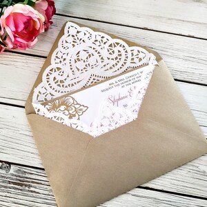 May include: A brown envelope with a white doily and a wedding invitation inside. The invitation is for Stephanie and [unclear text] and requests the honor of your presence at the marriage.