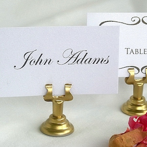 Portanúmeros de mesa dorados Portatarjetas de mesa dorado Portanúmeros de mesa de hierro fundido Elegante portatarjetas de mesa de boda de acero inoxidable Portaletreros