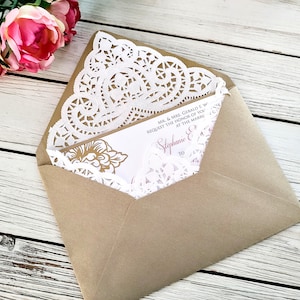 May include: A brown envelope with a white doily and a wedding invitation inside. The invitation is for Stephanie and [unclear text] and requests the honor of your presence at the marriage.
