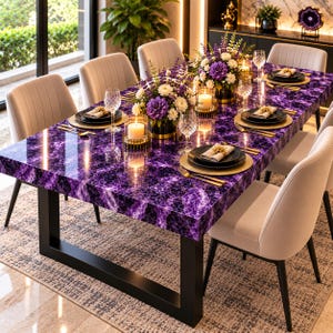 May include: A rectangular dining table with a polished purple agate stone surface and a black metal frame. The table is set with gold-rimmed plates, clear glassware, gold cutlery, white napkins, and floral centerpieces with candles.