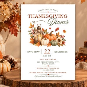 May include: A Thanksgiving dinner invitation card featuring a watercolor illustration of a lantern, pumpkins, and autumn leaves. The text reads: Please join us for a Thanksgiving Dinner, Saturday 22 November 6:00 PM, The Alex Home, 123 Alex Street.