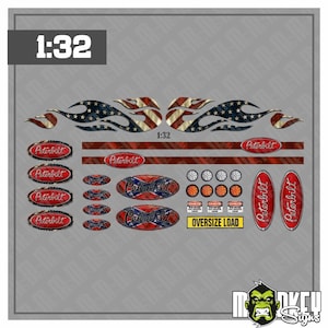 May include: A 1:32 scale decal sheet featuring Peterbilt logos, American flag flame graphics, red and white stripes, circular light icons, and rectangular warning labels with the text OVERSIZE LOAD and DANGER in black, red, white, and blue.